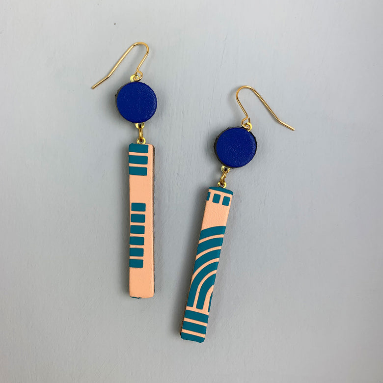 Handmade leather earrings featuring reclaimed leather blocks in peach, turquoise and blue