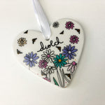 Ceramic heart decoration featuring the words 'thank you' in Welsh - Diolch, and a lovely floral design.