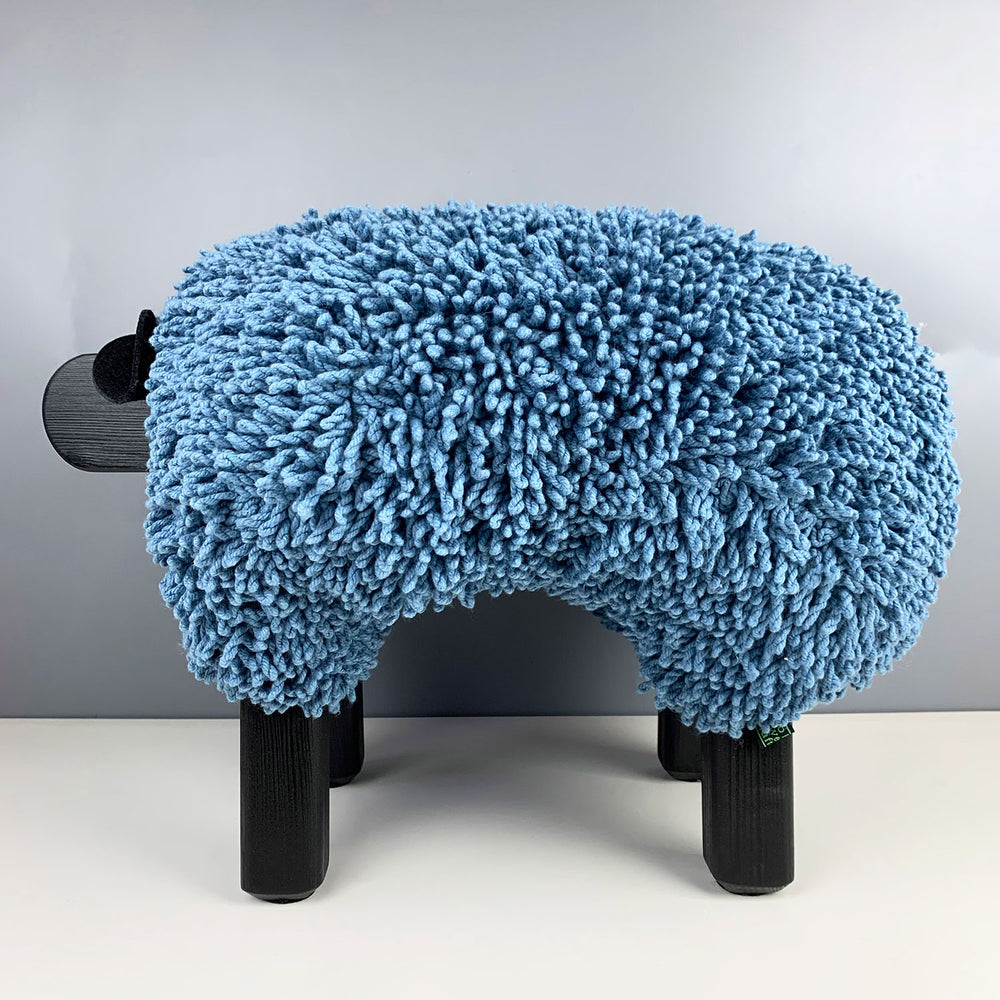 Ewemoo Welsh sheep footstool with blue cotton twist fabric, black head and legs