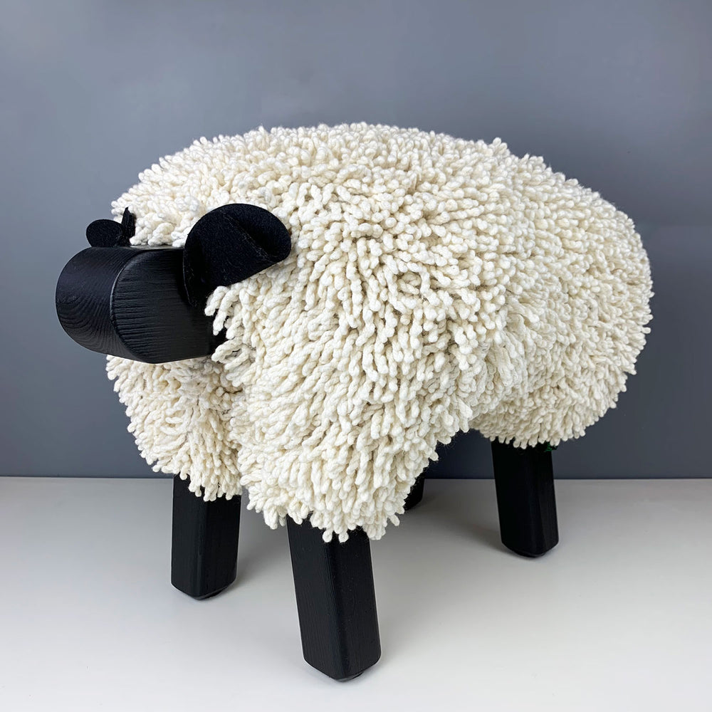 Ewemoo Welsh sheep footstool with ivory cotton twist fabric, black head and legs