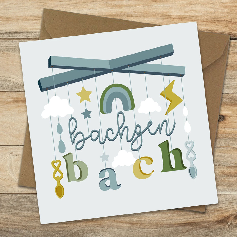 Welsh greeting card featuring a mobile and the words bachgen bach