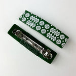 Handmade hair clips featuring the iconic Welsh blanket pattern in green.