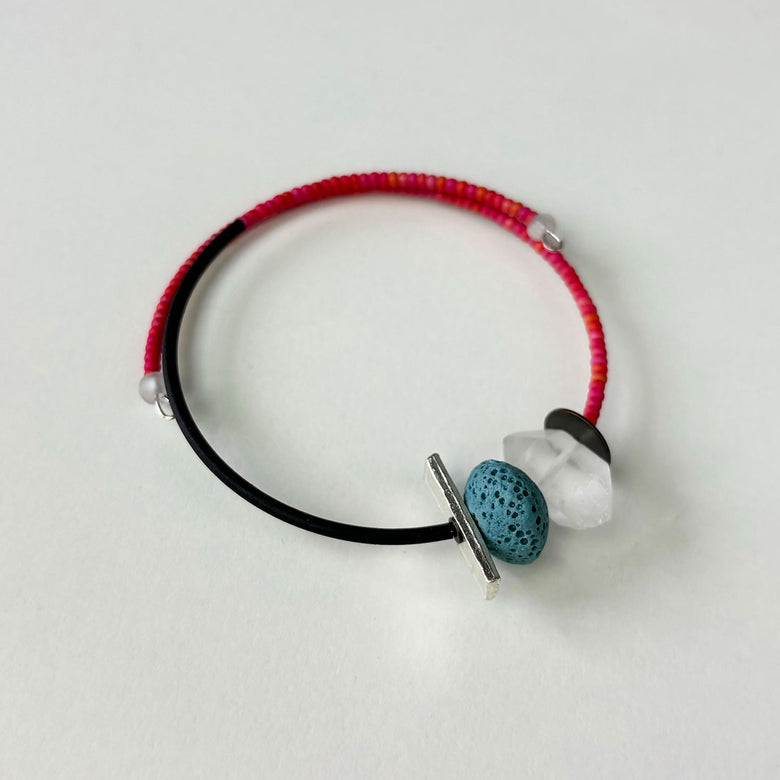 Handmade wrap bracelet by Deryn decorated with beads.