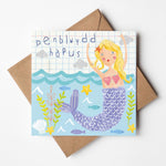 Welsh birthday card featuring a mermaid and the words 'happy birthday' in Welsh - Penblwydd hapus