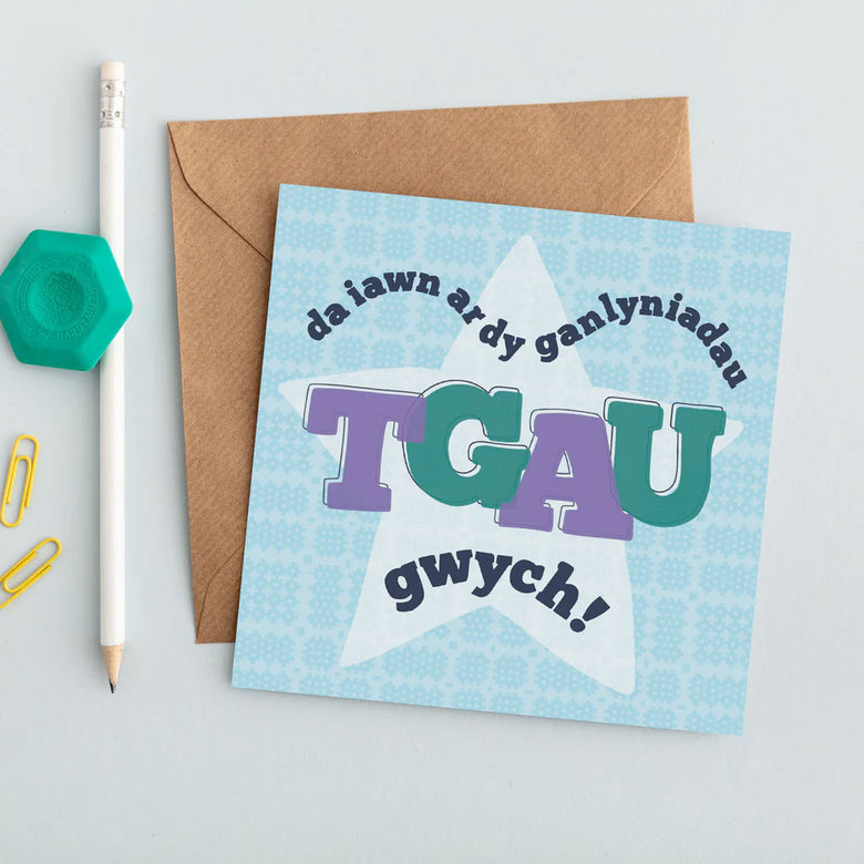 Contemporary greeting card featuring the words 'well done on your fantastic GCSE results' in Welsh