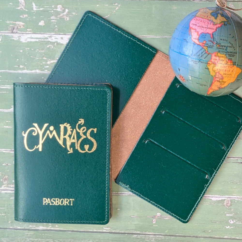 Green leather passport holder with 'Cymraes' 