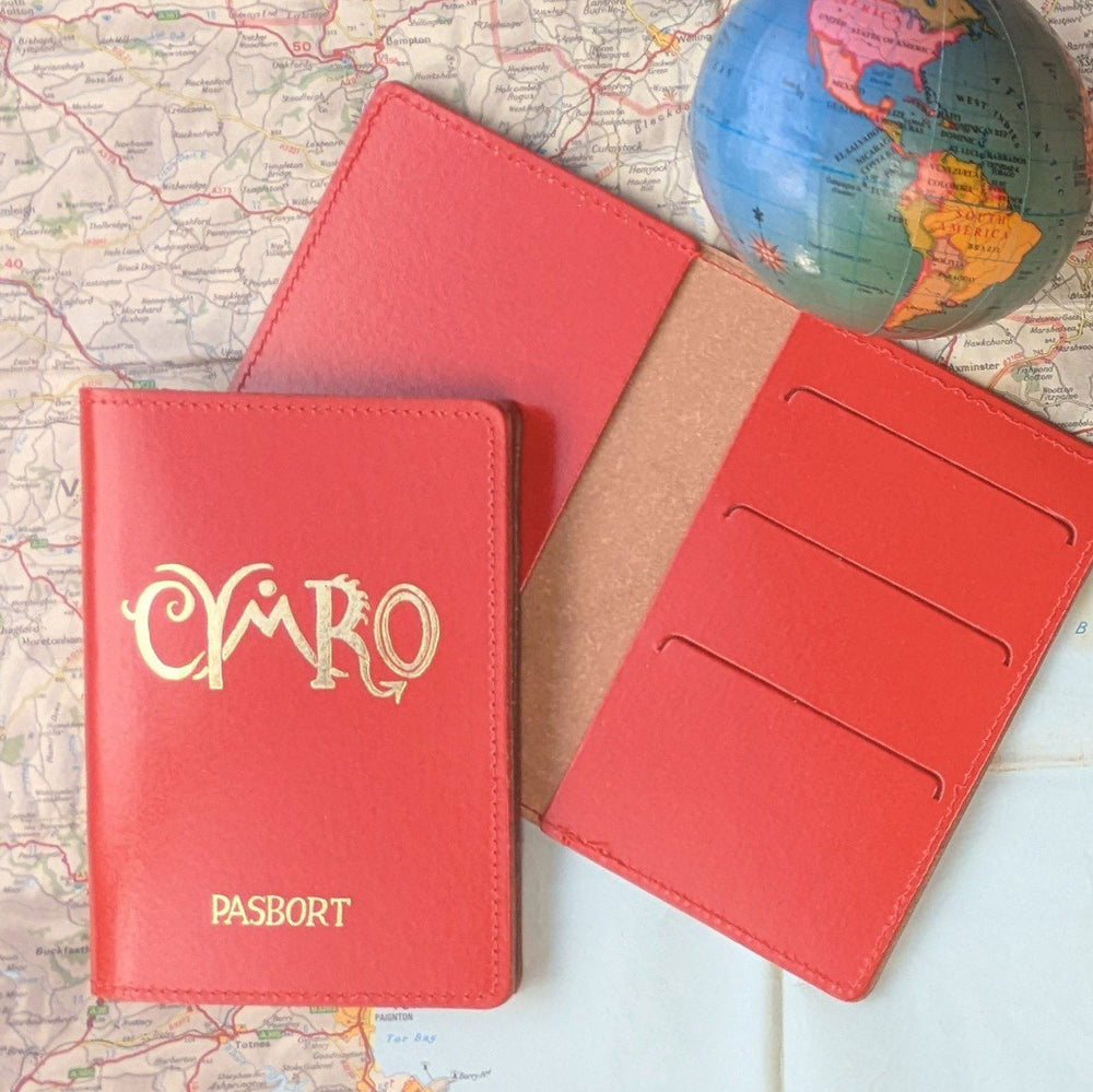 Red leather passport holder with 'Cymro' 