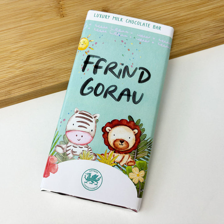 Luxury milk chocolate bar wrapped in patterned paper featuring the words 'best friend' in Welsh - Ffrind gorau.