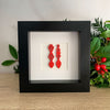 Framed Welsh love spoons - red/black frame
