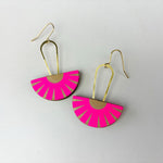 Handmade drop earrings made from double sided reclaimed leather in a fluoro pink and cream geometric pattern.