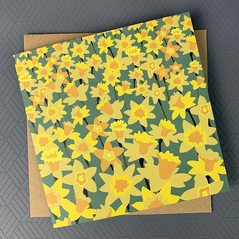 Colourul greeting card featuring a field of yellow daffodils