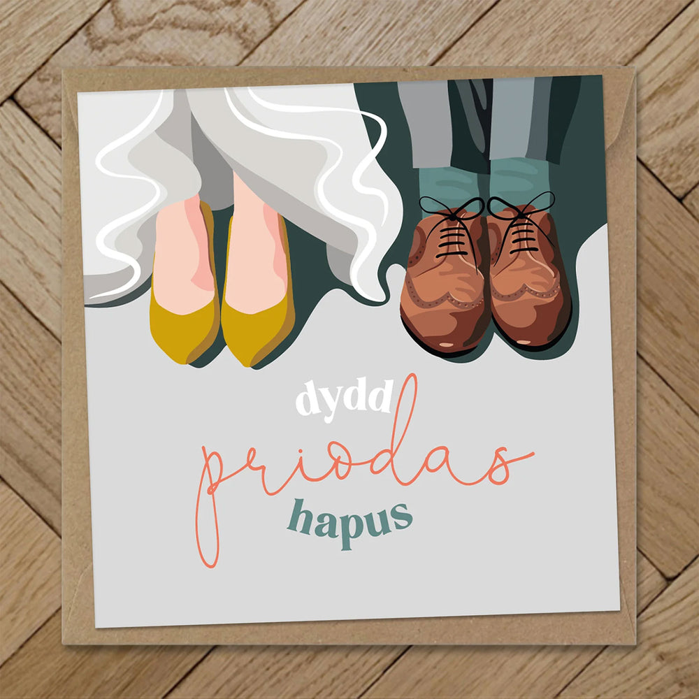 Welsh wedding greeting card featuring the bride and groom's feet and the words dydd priodas hapus