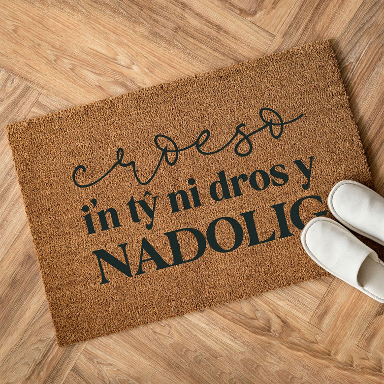 Croeso i'n tŷ ni Christmas doormat