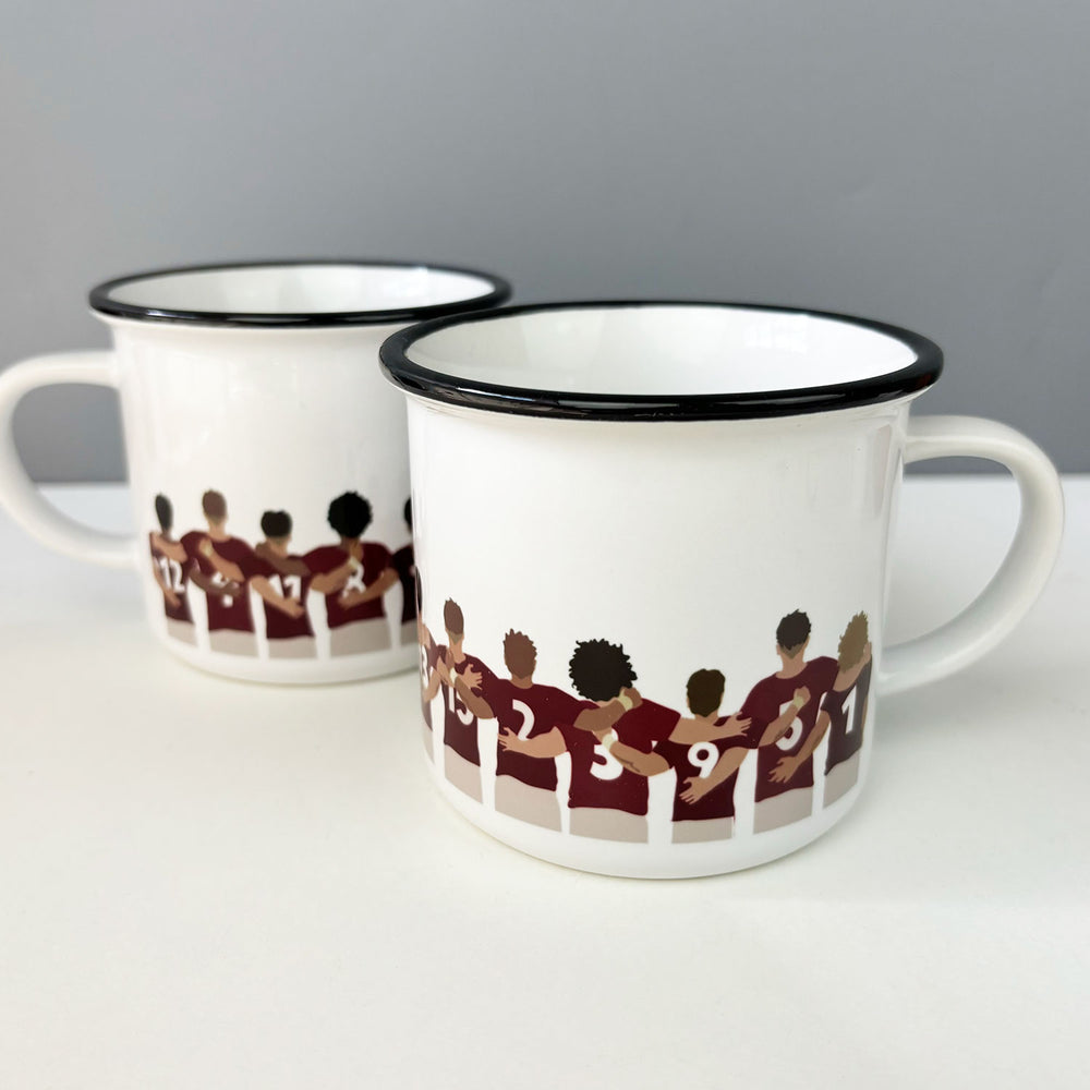 Ceramic camping style mug featuring a row of Welsh rugby players.