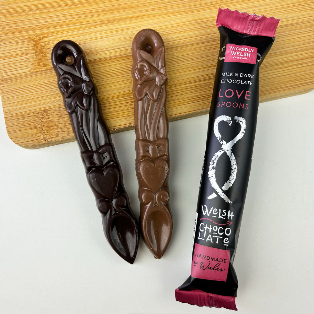 Two handmade milk and dark chocolate lovespoons by Welsh artisan chocolatiers Wickedly Welsh