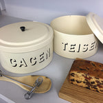 Cream enamel Welsh cake tin featuring the words Cacen and Teisen
