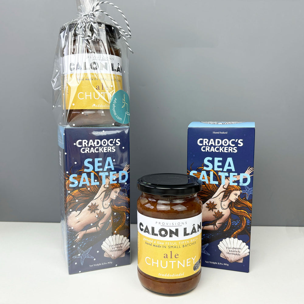 A jar of Calon Lân's delicious Welsh chutney paired with a box of Cradoc's handmade crackers, wrapped and tied with string.