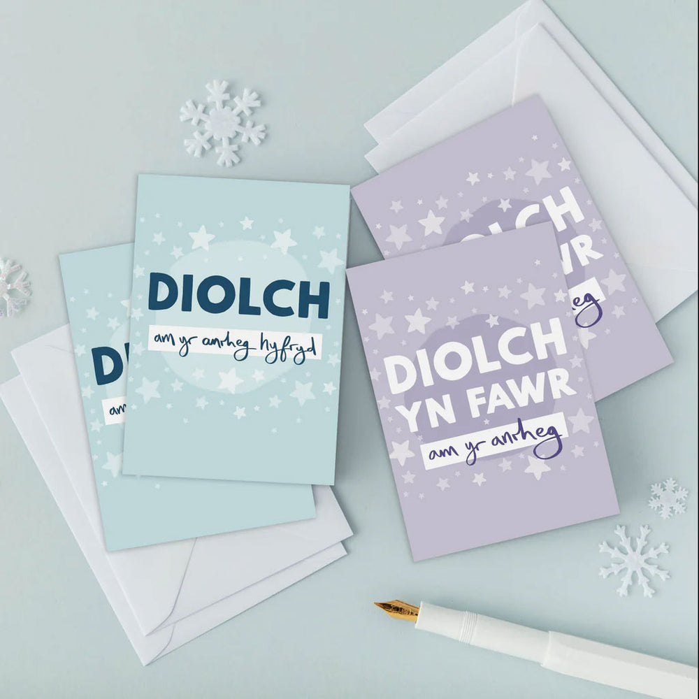 A pack mini Welsh Christmas cards by Draenog featuring the words 'thanks for my gift' in Welsh