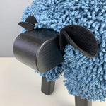 Ewemoo Welsh sheep footstool with blue cotton twist fabric, black head and legs