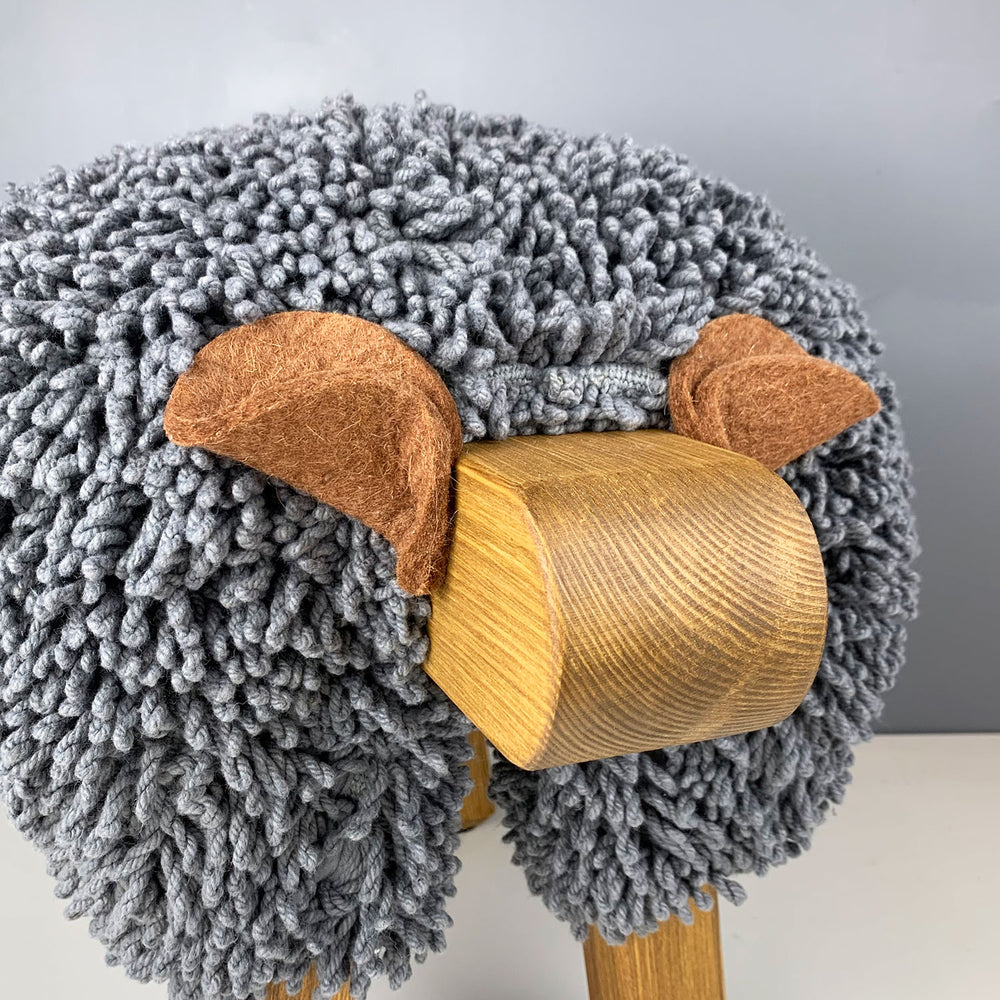 Ewemoo Welsh sheep footstool with grey cotton twist fabric, oak head and legs
