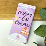 Luxury Welsh chocolate bar wrapped in patterned paper featuring the words 'best gran' in Welsh - Mamgu orau.