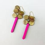 Handmade earrings made from double sided reclaimed leather blocks and circles in gold and neon pink