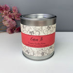 Hand poured soy wax scenetd candle presented in a tin featuring the words 'love you' in Welsh - Caru ti.