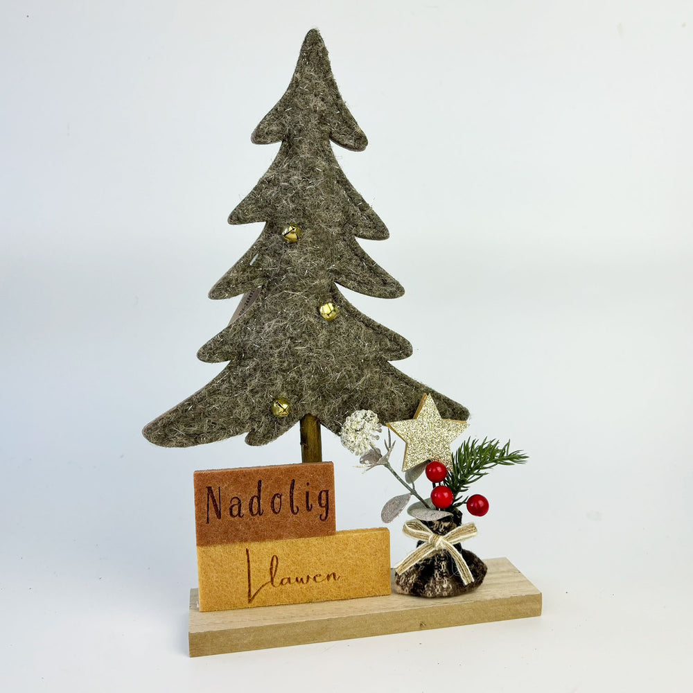 Decorative Christmas tree with 'Nadolig Llawen' sign on a white background
