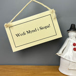Cream enamel sign featuring the words 'gone shopping!' in Welsh - Wedi mynd i siopa!