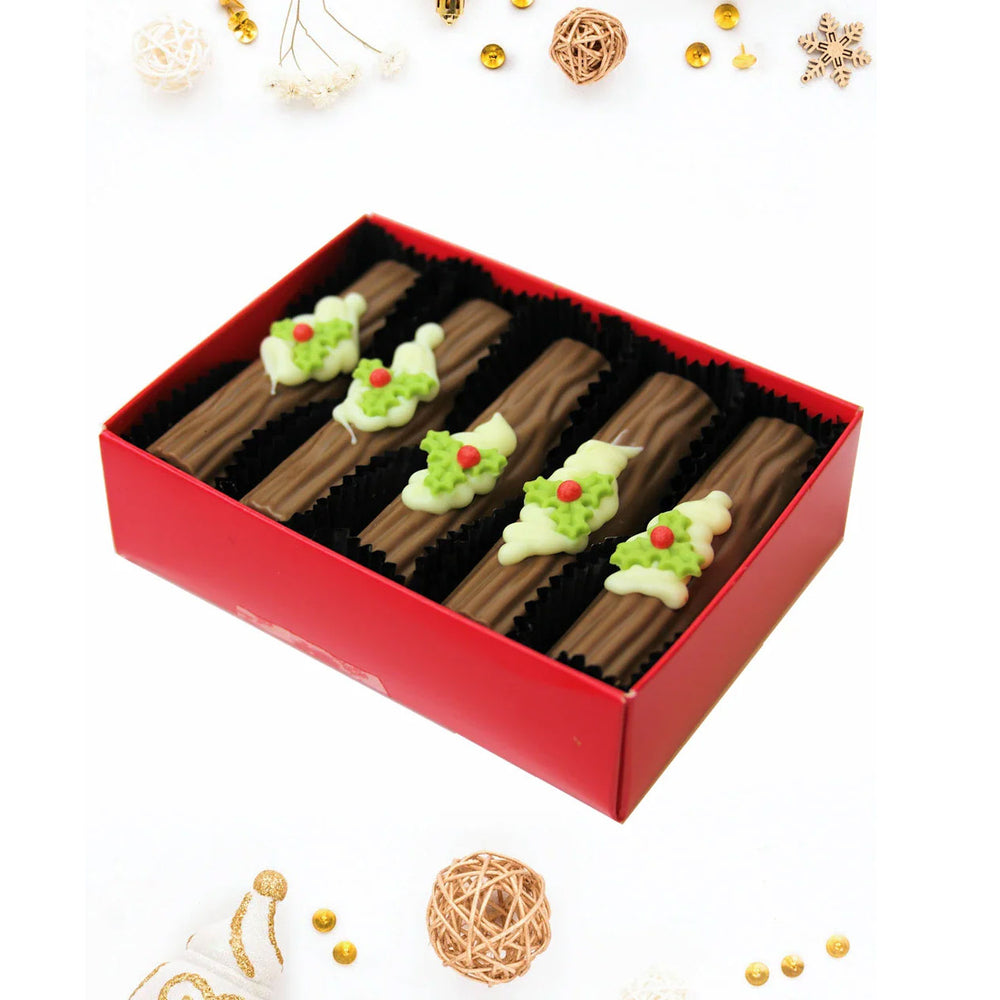 Chocolate yule logs with handcrafted sugar holly by Wickedly Welsh