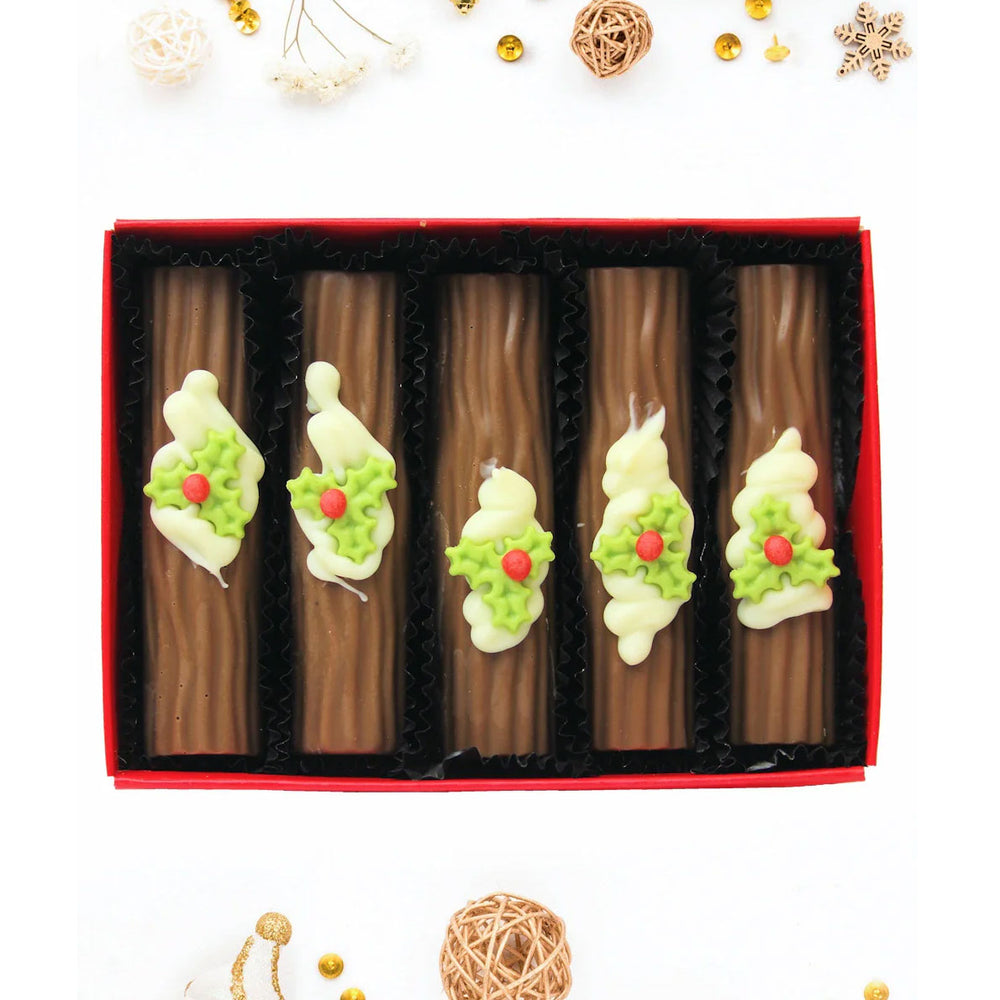 Chocolate yule logs with handcrafted sugar holly by Wickedly Welsh