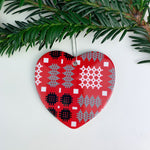 Heart shaped Christmas decoration hung on a Christmas tree