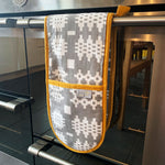 Grey Welsh blanket print oven glove with mustard yellow piping