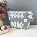 Grey Welsh blanket print make-up bag with contrasting yellow zip