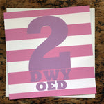 Welsh pink 2nd birthday card featuring the words 2 oed