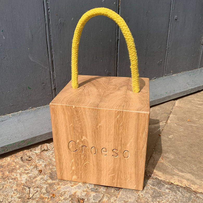 Personalised oak doorstop with rope handle