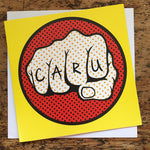 Welsh card featuring a comic style fist tattooed with the word Caru, love
