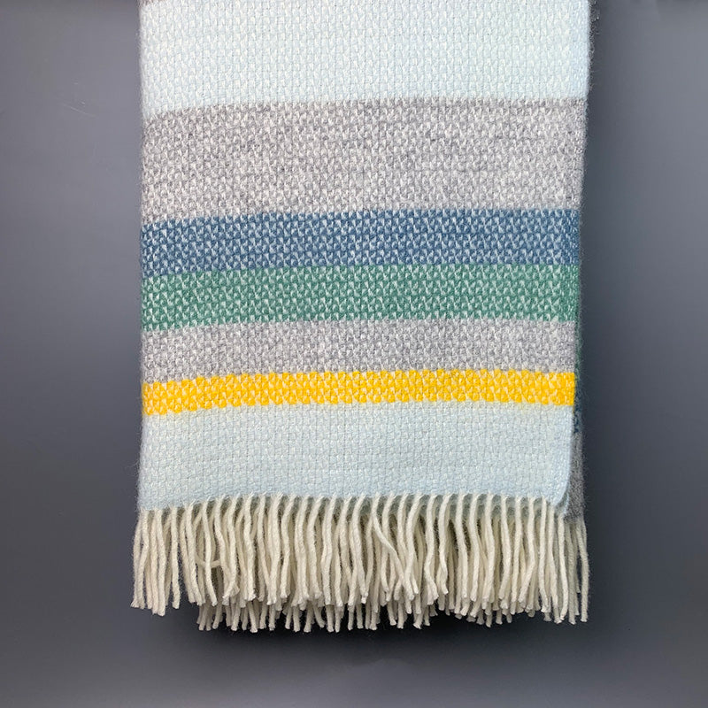 Welsh wool horizon throw in yellow, blue and grey stripes made in Wales by Tweedmill